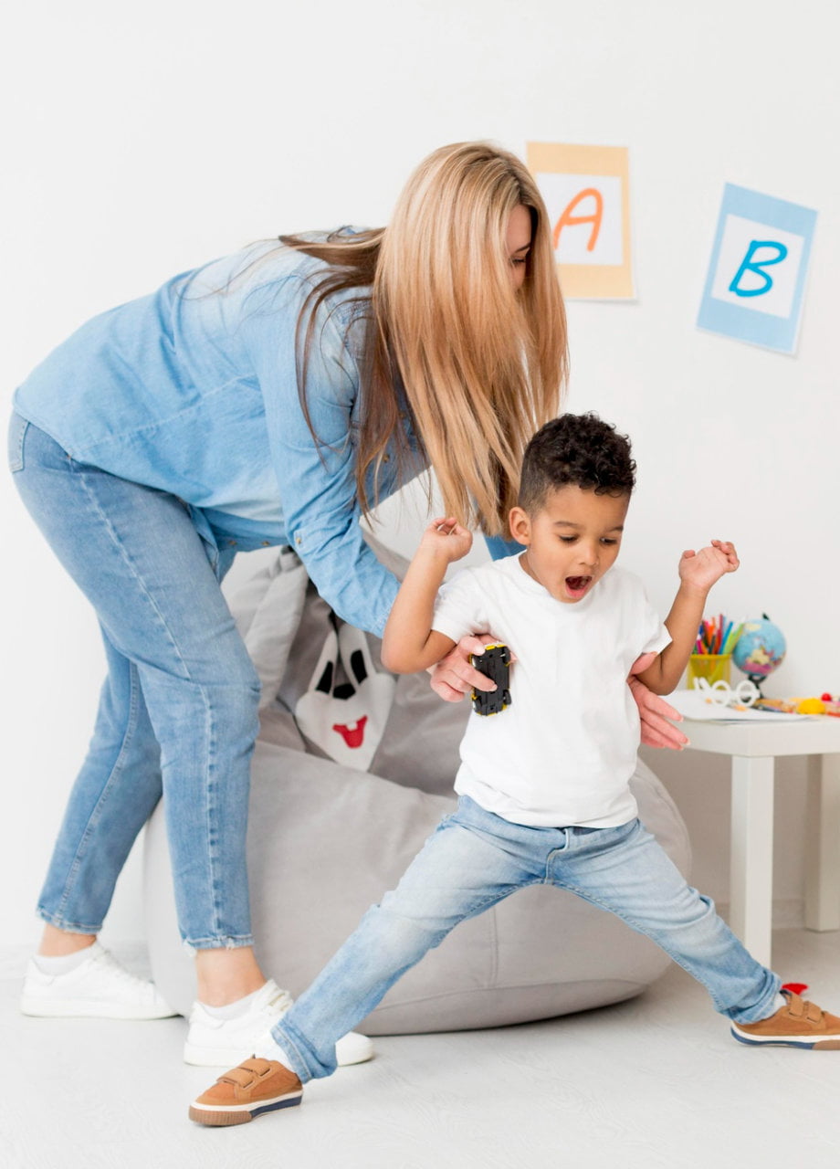 Everyday Denim - Young Woman with her boy playing